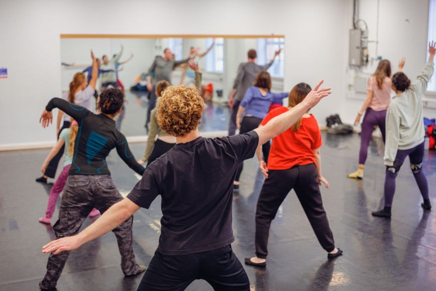 people stretching in a dancce studio